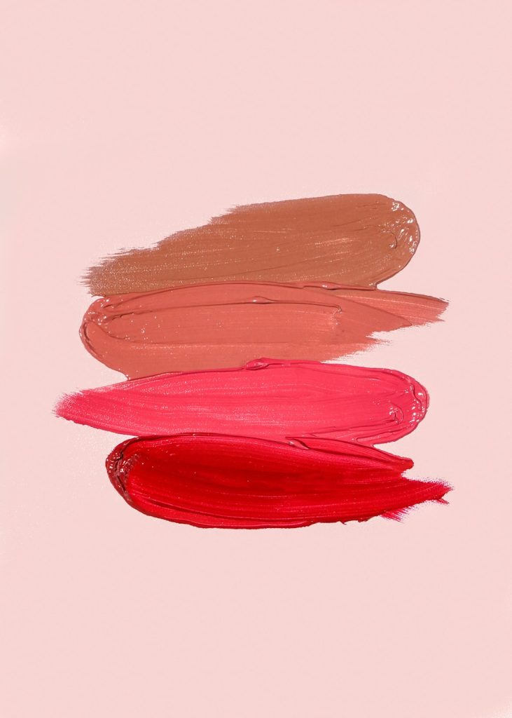 MISS SWISS Matte Lipstick Swatches on a pink background